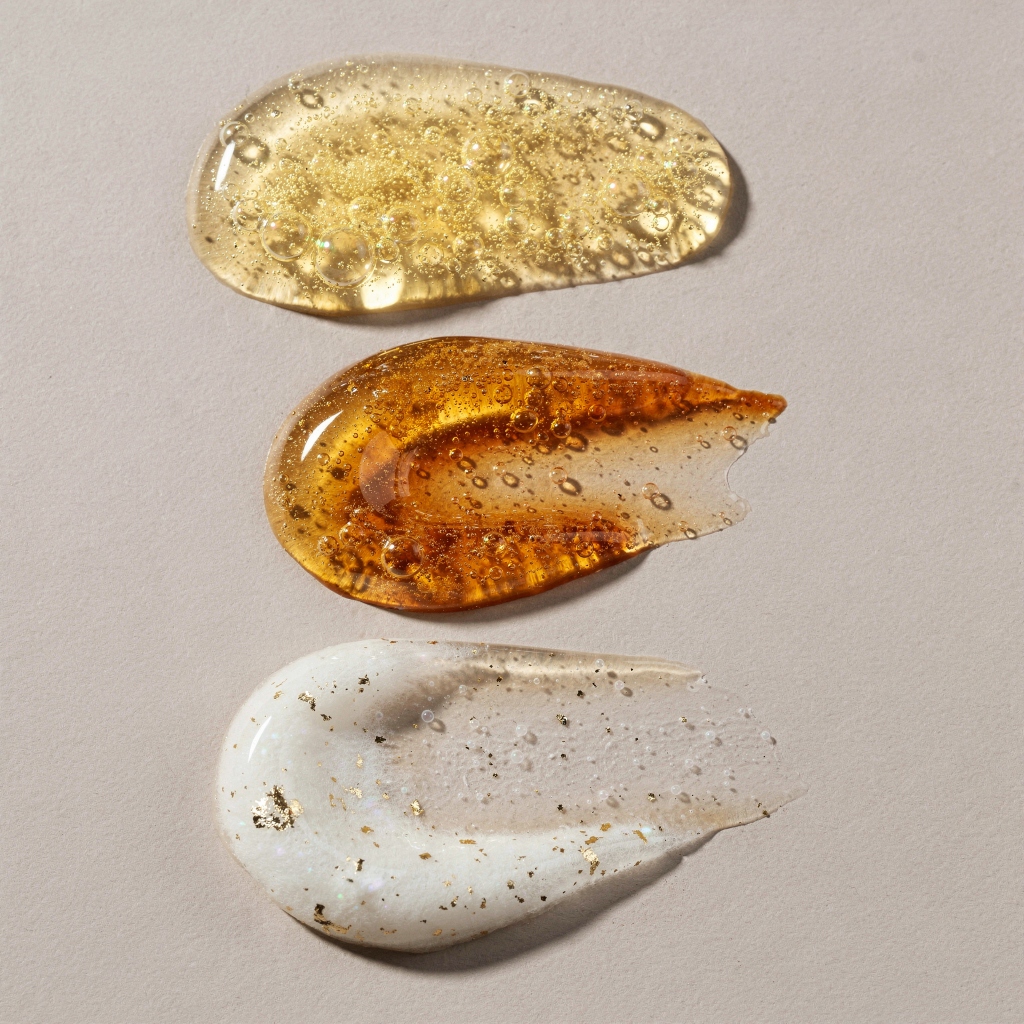 AI-generated serum and cream texture swatches showing premium formulation detail
