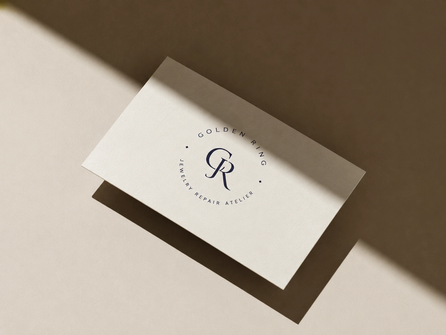 Golden Ring monogram card with circular atelier seal