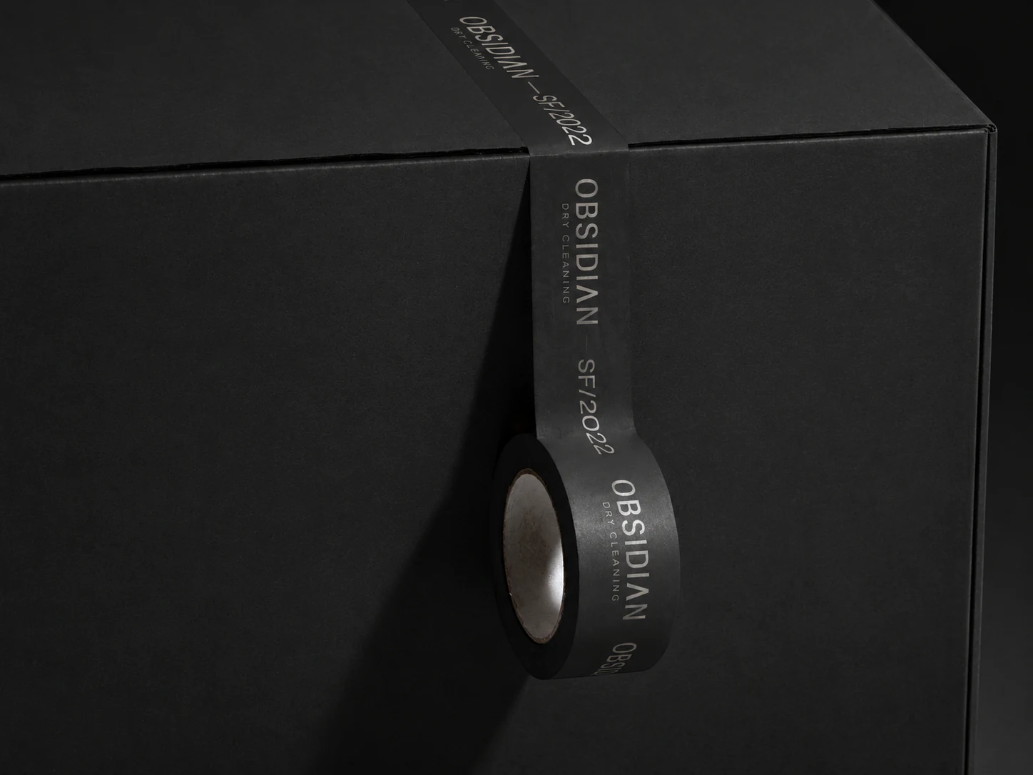 Obsidian black packaging tape and box detail